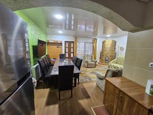 a kitchen and dining room with a table in a rv at La 7 Frati in Holda