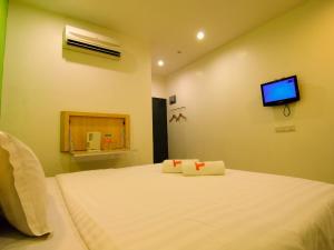 Postel nebo postele na pokoji v ubytování T Hotel Changlun