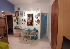 a room with a table and a room with a bathroom at Angel's House Flamengo RJ in Rio de Janeiro +10 photos