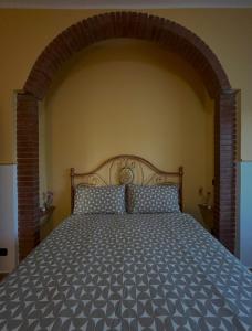 Ένα ή περισσότερα κρεβάτια σε δωμάτιο στο Guzzolini Camere & Relax