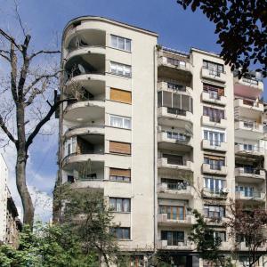 an apartment building with balconies on the side of it at Cisimigu Garden Studio in Bucharest