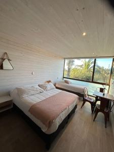 Ένα ή περισσότερα κρεβάτια σε δωμάτιο στο Hotel Casa Surf