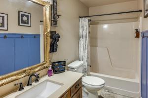 a bathroom with a sink and a toilet and a mirror at 4 Mi to Dtwn The Crash Site Roswell Home! in Roswell +19 photos