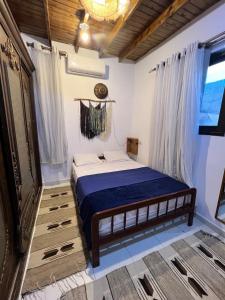 Ένα ή περισσότερα κρεβάτια σε δωμάτιο στο Marboha House