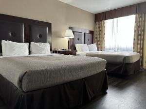 Ένα ή περισσότερα κρεβάτια σε δωμάτιο στο Quality Inn & Suites Everett +76 φωτογραφίες