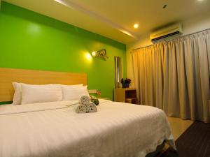 เตียงในห้องที่ T Hotel Kuala Perlis