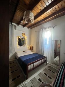 Ένα ή περισσότερα κρεβάτια σε δωμάτιο στο Marboha House