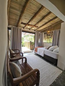 En eller flere senge i et værelse på Casa das Pedras Caraiva