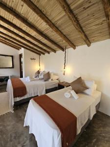 En eller flere senge i et værelse på Casa das Pedras Caraiva