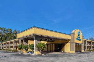 a hotel building with a parking lot in front of it at Best Western Of Walterboro in Walterboro