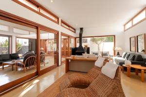 a living room with a couch and a table at Canaryislandshost l Pausa in Costa Teguise