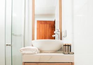 a bathroom with a white bowl sink on a cabinet at Aranwa Vichayito Beach Resort in Vichayito