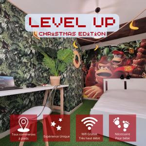 a room with a bed and a sign that reads level up christmas edition at LevelUp Disneyland Family in Meaux
