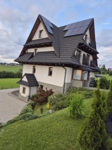 a house with solar panels on top of it at Janicek in Ząb