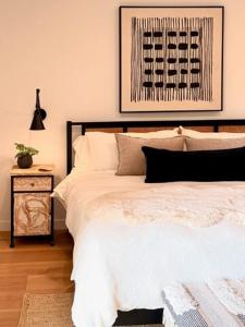 Una cama o camas en una habitación de Hillside Haven - Boutique Spanish Escape