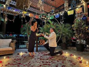 a man and a woman standing in a room with lights at Grann Posada Xilitla in Xilitla +170 photos