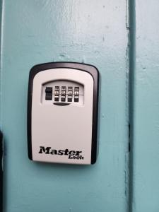 a button on a wall with the name master fight on it at Luxury 1-Bedroom Apartment - Central Dundee in Dundee