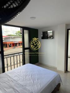 Postel nebo postele na pokoji v ubytování Hotel Alojamientos Villavicencio