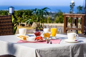 a table with a plate of food and drinks on it at Jeju Starlight Glamping in Jeju