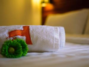 Postel nebo postele na pokoji v ubytování T Hotel Tandop