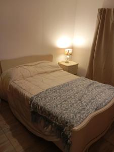 Ένα ή περισσότερα κρεβάτια σε δωμάτιο στο Complejo La Emilce +4 φωτογραφίες