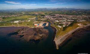 an aerial view of a town next to the water at Lake District Fully Furnished Home in Mossbay