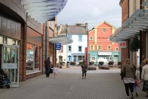 a group of people walking down a city street at Lake District Fully Furnished Home in Mossbay