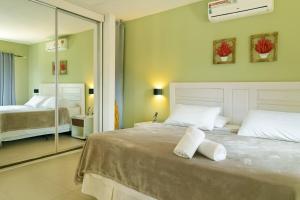 En eller flere senge i et værelse på Casa Pimenta - Apto aconchegante perto da rua do Mucugê