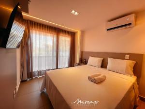 TV/trung tâm giải trí tại Maravilhoso flat vista mar no Altamare