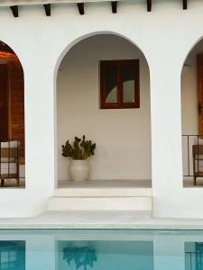 a villa with a swimming pool and a house at Casa Mimo Altea in Altea