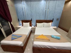 Ένα ή περισσότερα κρεβάτια σε δωμάτιο στο Cairo-Plaza, Halo Hotel