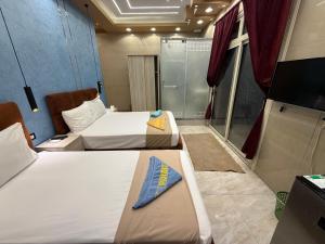 Ένα ή περισσότερα κρεβάτια σε δωμάτιο στο Cairo-Plaza, Halo Hotel