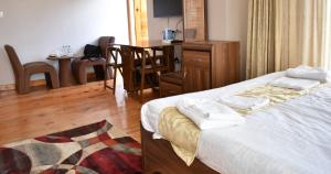 Ένα ή περισσότερα κρεβάτια σε δωμάτιο στο Hotel GaiaYuel