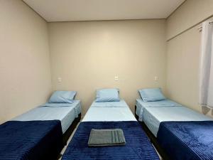 Ένα ή περισσότερα κρεβάτια σε δωμάτιο στο Hotel União Centro