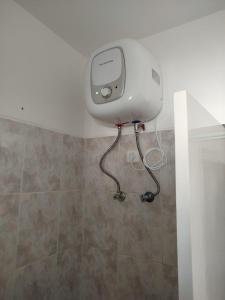 a bathroom with a toilet in the corner of a room at Paraiso 162E in Santa Maria