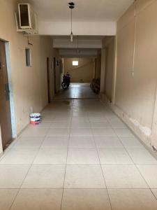 an empty hallway of an empty building with a room with a room at Hotel 5 irmãos in Araripina