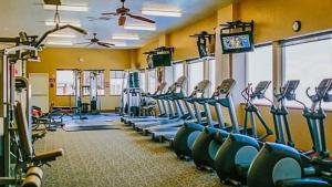 a gym with rows of treadmills and machines at Cozy King Suite in Downtown Midway Near Park City Ski Resorts - 207 in Mound City