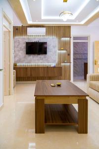 a living room with a wooden table and a couch at Dar Belleza in Tangier