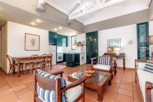 a living room with a couch and a table at Barbati Beach - Villa Ithika in Barbati