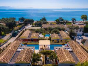 an aerial view of a resort with the ocean in the background at Barbati Beach - Villa Ithika in Barbati