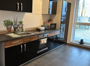 Η κουζίνα ή μικρή κουζίνα στο Pension Boardinghaus Dingolfing +9 φωτογραφίες