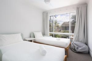 Postel nebo postele na pokoji v ubytování Driftwood House