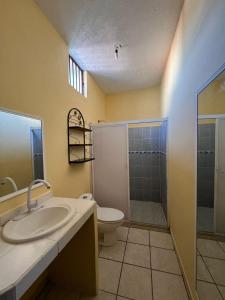 a bathroom with a sink and a toilet and a shower at Casa en Manzanillo in Manzanillo +45 photos