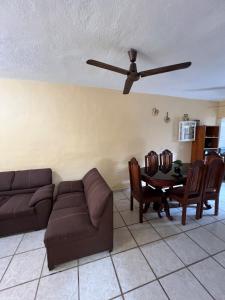 a living room with a couch and a table at Casa en Manzanillo in Manzanillo