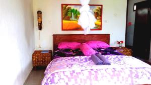 Postel nebo postele na pokoji v ubytování Ariel Bungalow Tetebatu