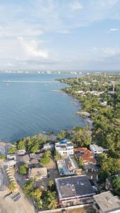 an aerial view of a city and the ocean at Casa Claro del Mar in Coveñas