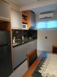 Kuchyň nebo kuchyňský kout v ubytování Coqueto y cómodo Duplex