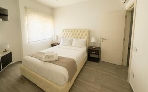 Ένα ή περισσότερα κρεβάτια σε δωμάτιο στο Three-Bedroom Apartment with Stunning Views +15 φωτογραφίες