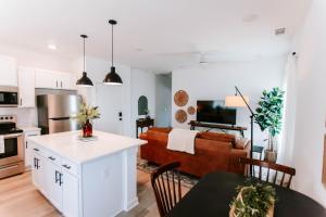 a kitchen and living room with a couch and a table at Mid-Term Discounts - Near Downtown, UGA, Hospital in Athens