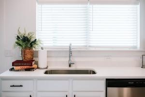 a kitchen counter with a sink and a window at Mid-Term Discounts - Near Downtown, UGA, Hospital in Athens +54 photos